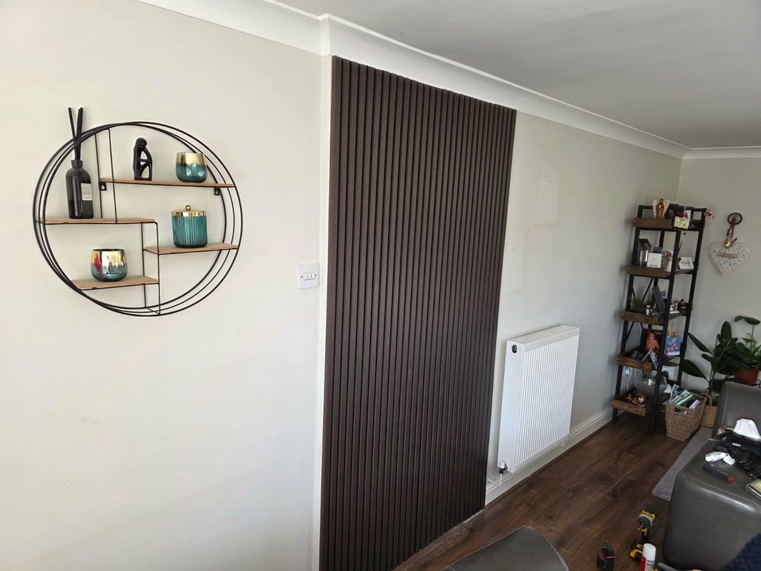 Dark slatted feature wall installed in the living room
